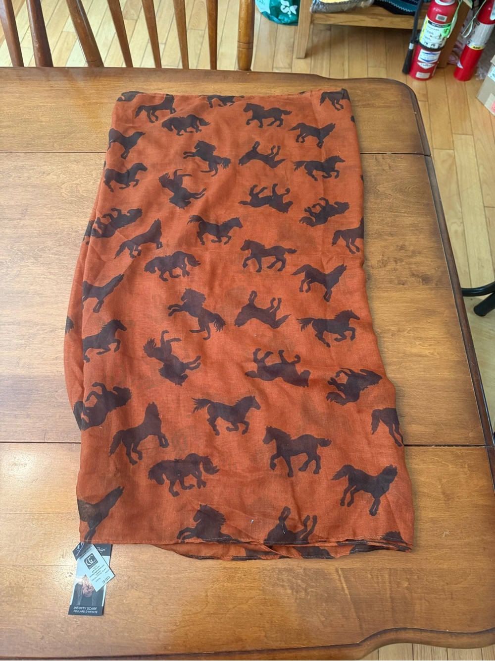 Charlie Paige Rust Scarf with Dark Horse Print